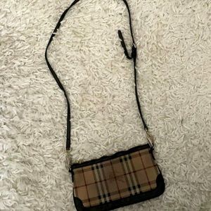Small Burberry cross body bag. Worn